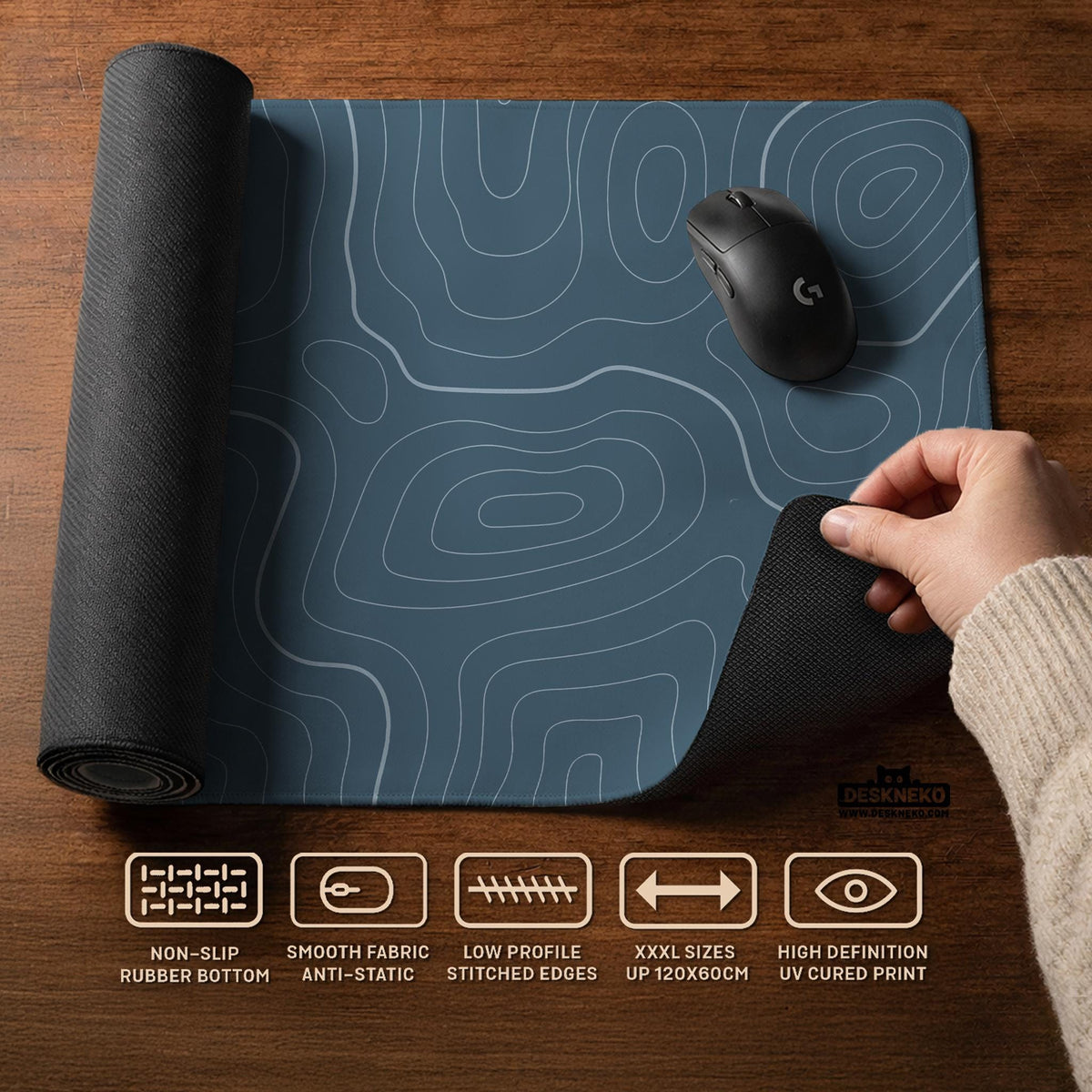 Blue mousepad with a topographic line pattern on a slate background.