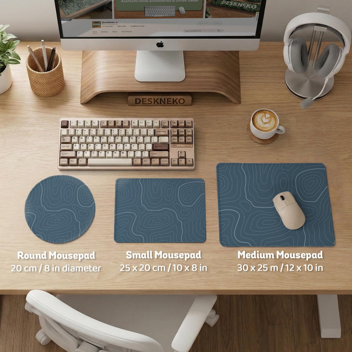 Blue mousepad with a topographic line pattern on a slate background.