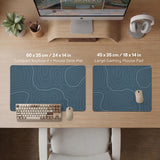 A slate blue desk mat with thin contour line map art on a light background.