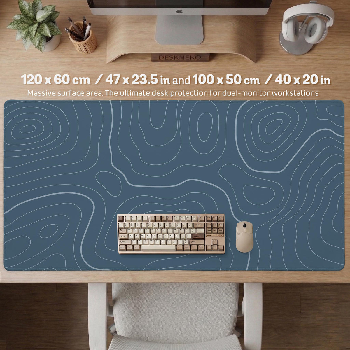 A slate blue desk mat with thin contour line map art on a light background.