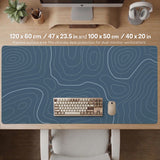 Blue mousepad with a topographic line pattern on a slate background.