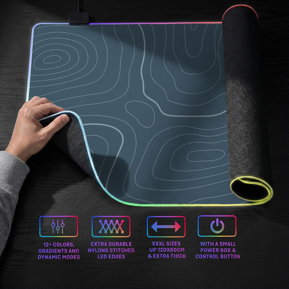 A slate blue desk mat with thin contour line map art on a light background.