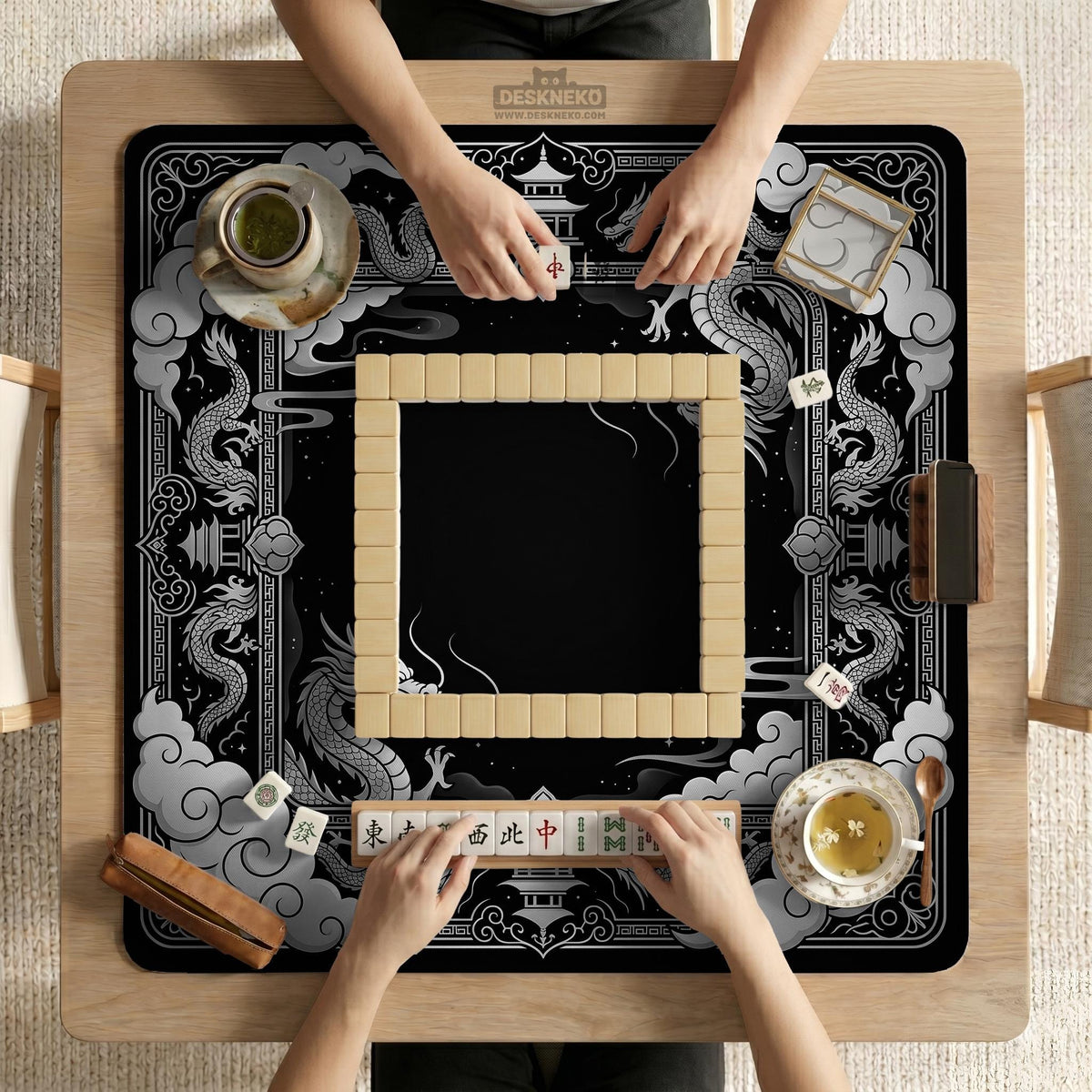 Square mahjong table mat with a black and silver dragon border, cloud details, and a scalloped edge.