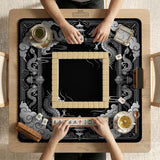Square mahjong table mat with a black and silver dragon border, cloud details, and a scalloped edge.