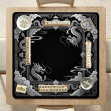 Square mahjong table mat with a black and silver dragon border, cloud details, and a scalloped edge.