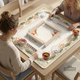 Ivory square mahjong mat with watercolor koi fish, lotus flowers, peach blossoms, sage leaves, and a thin gold border.
