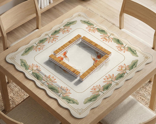 Ivory square mahjong mat with watercolor koi fish, lotus flowers, peach blossoms, sage leaves, and a thin gold border.