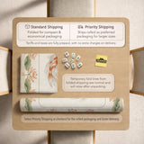 Ivory square mahjong mat with watercolor koi fish, lotus flowers, peach blossoms, sage leaves, and a thin gold border.