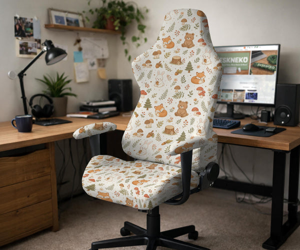 A gaming chair cover with a woodland animal print featuring foxes, rabbits, bears, mushrooms, and leaves in green, brown, and beige tones.