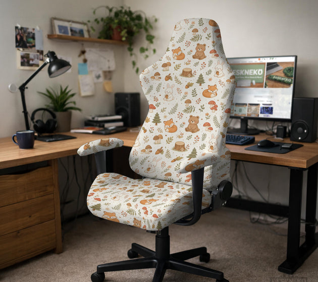 A gaming chair cover with a woodland animal print featuring foxes, rabbits, bears, mushrooms, and leaves in green, brown, and beige tones.