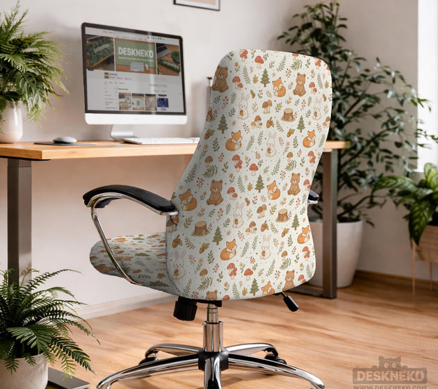 A gaming chair cover with a woodland animal print featuring foxes, rabbits, bears, mushrooms, and leaves in green, brown, and beige tones.