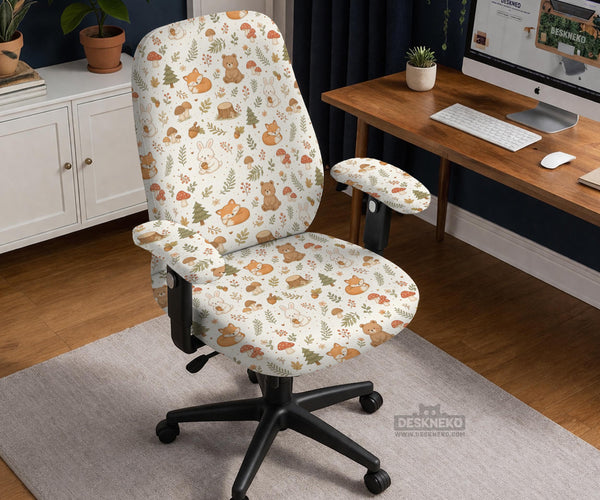 A gaming chair cover with a woodland animal print featuring foxes, rabbits, bears, mushrooms, and leaves in green, brown, and beige tones.