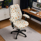 A gaming chair cover with a woodland animal print featuring foxes, rabbits, bears, mushrooms, and leaves in green, brown, and beige tones.