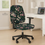 Green chair cover with a dark floral pattern, pink roses, cream flowers, and leafy botanical details on an office chair.