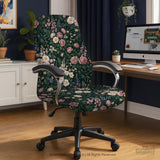 Green chair cover with a dark floral pattern, pink roses, cream flowers, and leafy botanical details on an office chair.