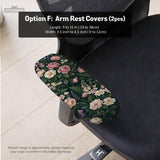 Green chair cover with a dark floral pattern, pink roses, cream flowers, and leafy botanical details on an office chair.