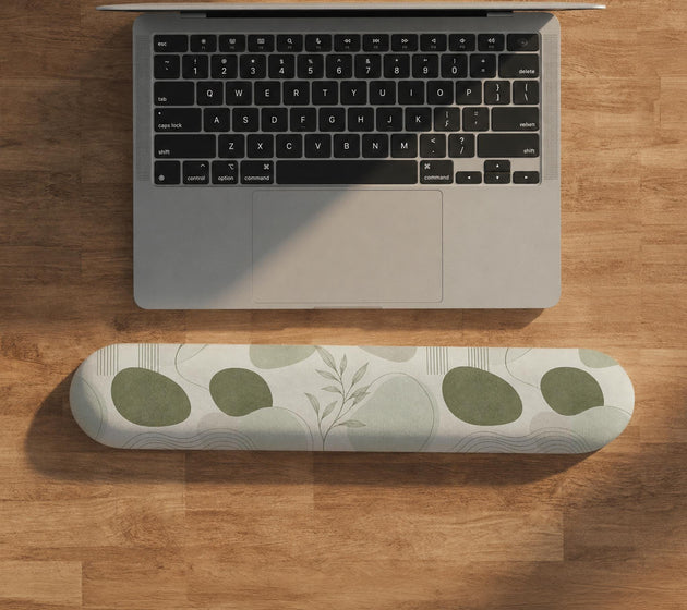 Green abstract botanical mouse pad with a rounded organic pattern and matching keyboard wrist rest option.