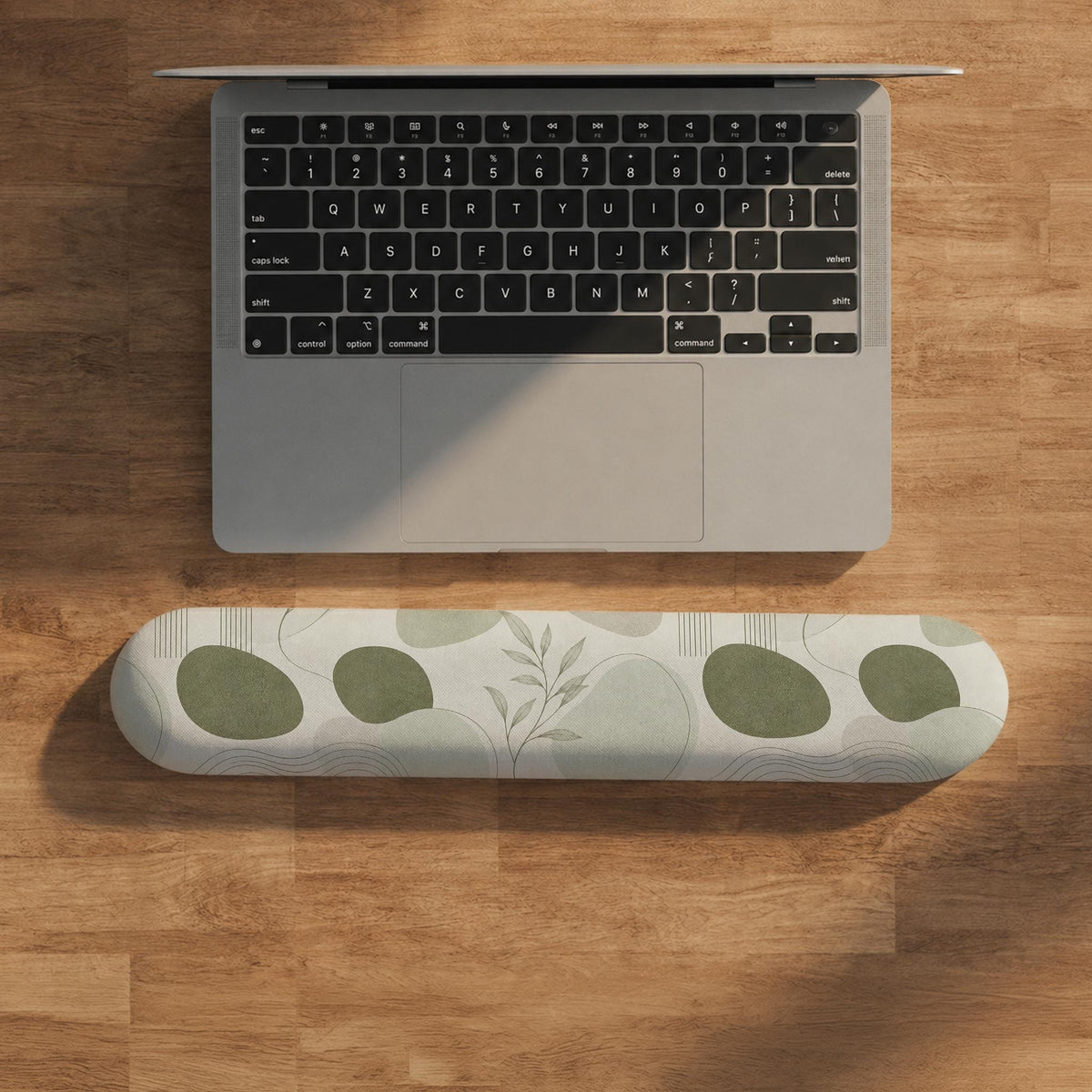 Green abstract botanical mouse pad with a rounded organic pattern and matching keyboard wrist rest option.