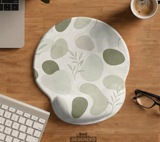 Green abstract botanical mouse pad with a rounded organic pattern and matching keyboard wrist rest option.
