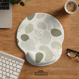 Green abstract botanical mouse pad with a rounded organic pattern and matching keyboard wrist rest option.
