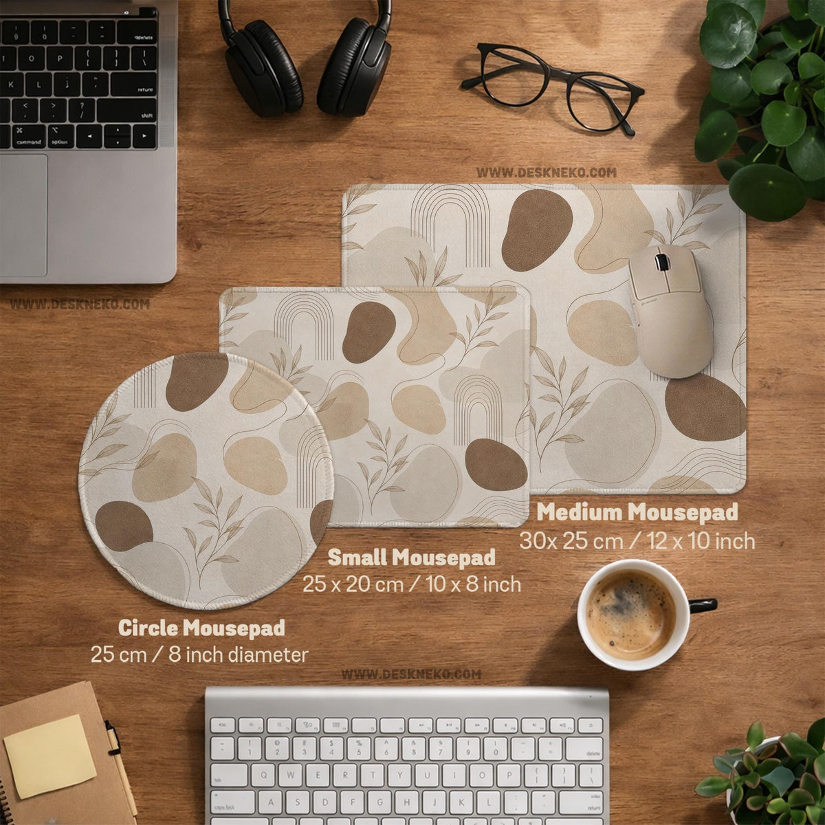 Beige desk mat with fine botanical line drawings and soft abstract shapes on a light neutral background.