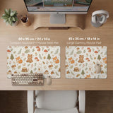 Cream desk mat with a woodland animal pattern featuring foxes, bunnies, mushrooms, berries, acorns, and sage leaves in soft green tones.