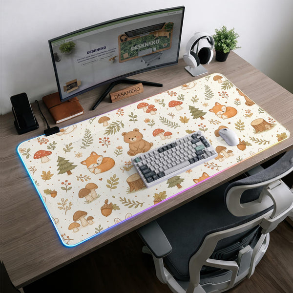 Cream desk mat with a woodland animal pattern featuring foxes, bunnies, mushrooms, berries, acorns, and sage leaves in soft green tones.