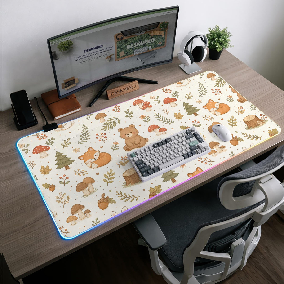 Cream desk mat with a woodland animal pattern featuring foxes, bunnies, mushrooms, berries, acorns, and sage leaves in soft green tones.