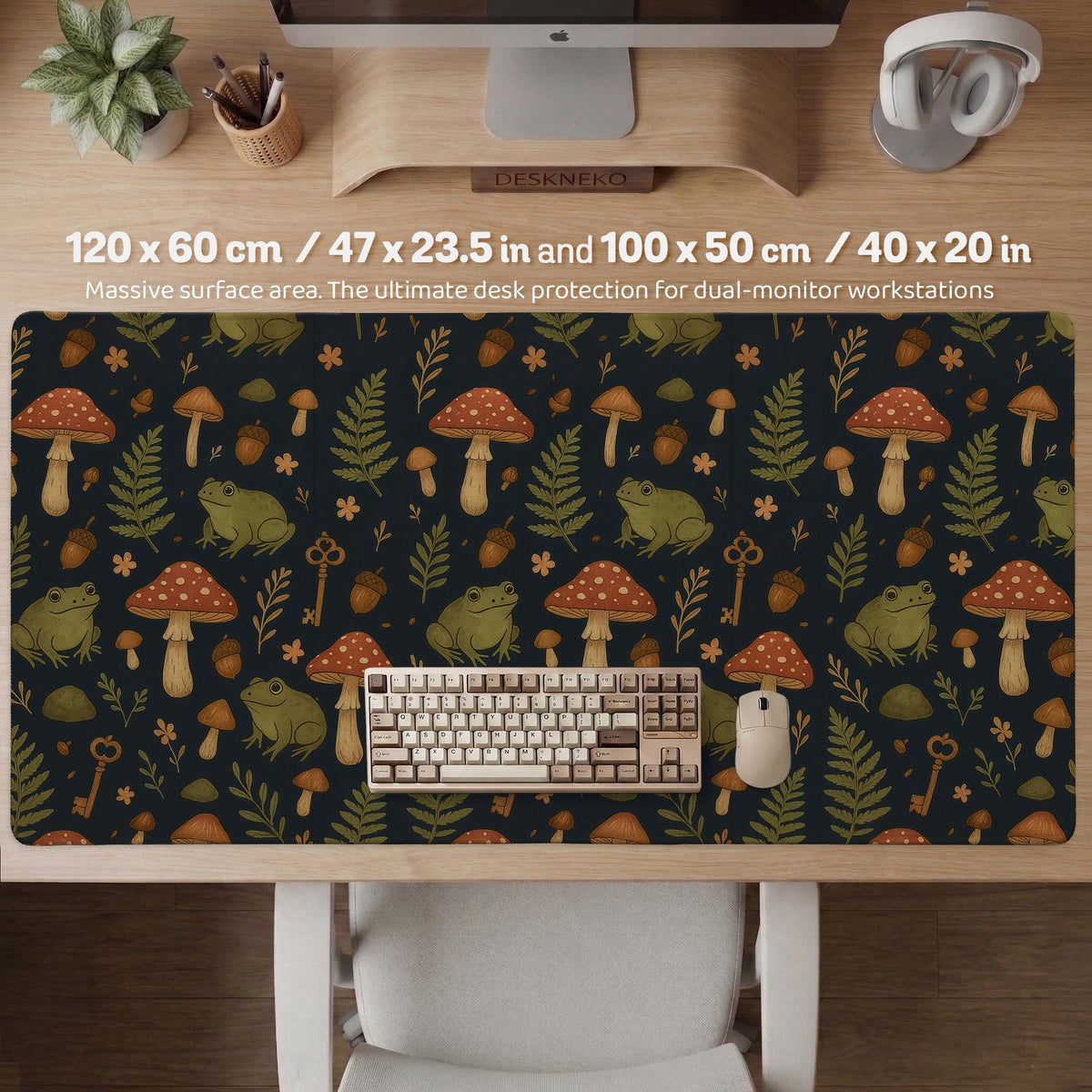 Dark forest-themed desk mat with an all-over pattern of frogs, mushrooms, fern leaves, acorns, tiny flowers, and antique keys.