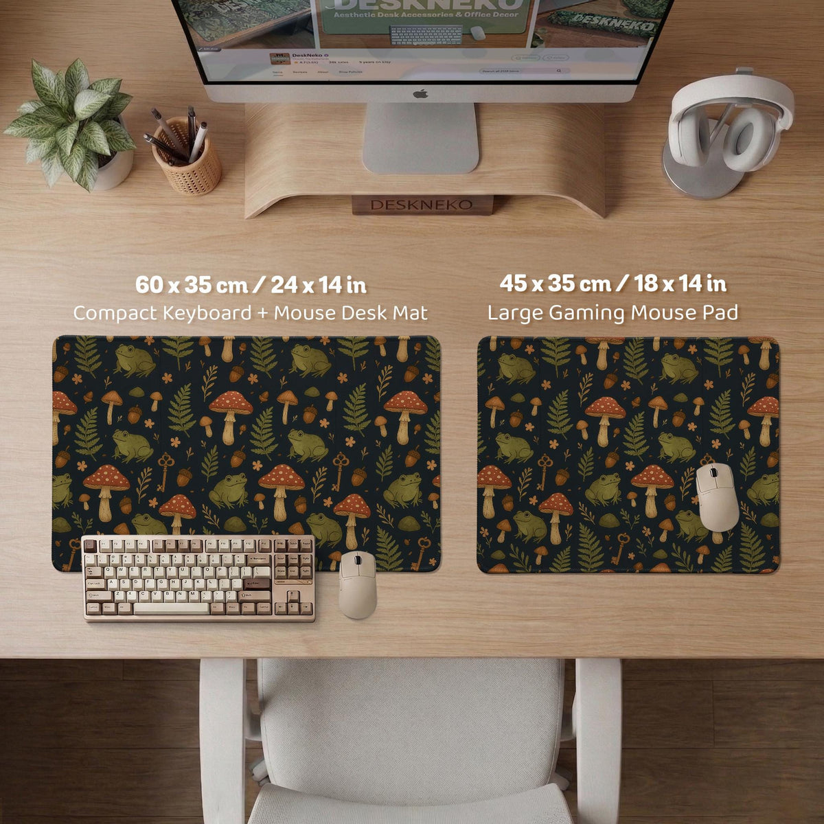 Dark forest-themed desk mat with an all-over pattern of frogs, mushrooms, fern leaves, acorns, tiny flowers, and antique keys.