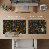 Dark forest-themed desk mat with an all-over pattern of frogs, mushrooms, fern leaves, acorns, tiny flowers, and antique keys.
