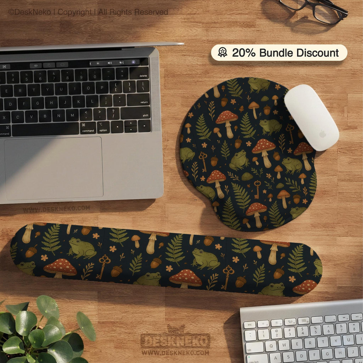 Dark forest-themed desk mat with an all-over pattern of frogs, mushrooms, fern leaves, acorns, tiny flowers, and antique keys.