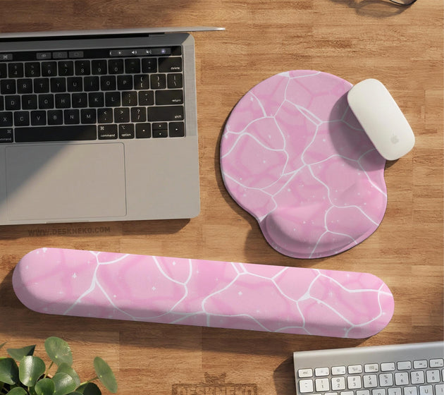 Soft pink mouse pad and wrist rest with a cloud-marble pattern, pale linework, and small star details.