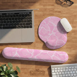 Soft pink mouse pad and wrist rest with a cloud-marble pattern, pale linework, and small star details.