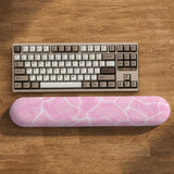 Soft pink mouse pad and wrist rest with a cloud-marble pattern, pale linework, and small star details.