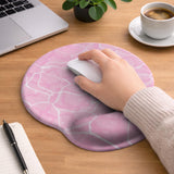 Soft pink mouse pad and wrist rest with a cloud-marble pattern, pale linework, and small star details.