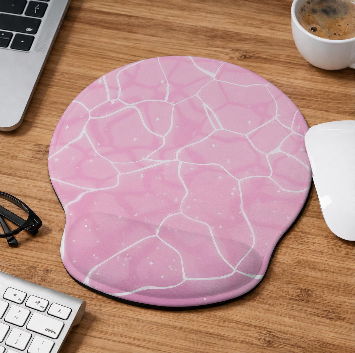 Soft pink mouse pad and wrist rest with a cloud-marble pattern, pale linework, and small star details.