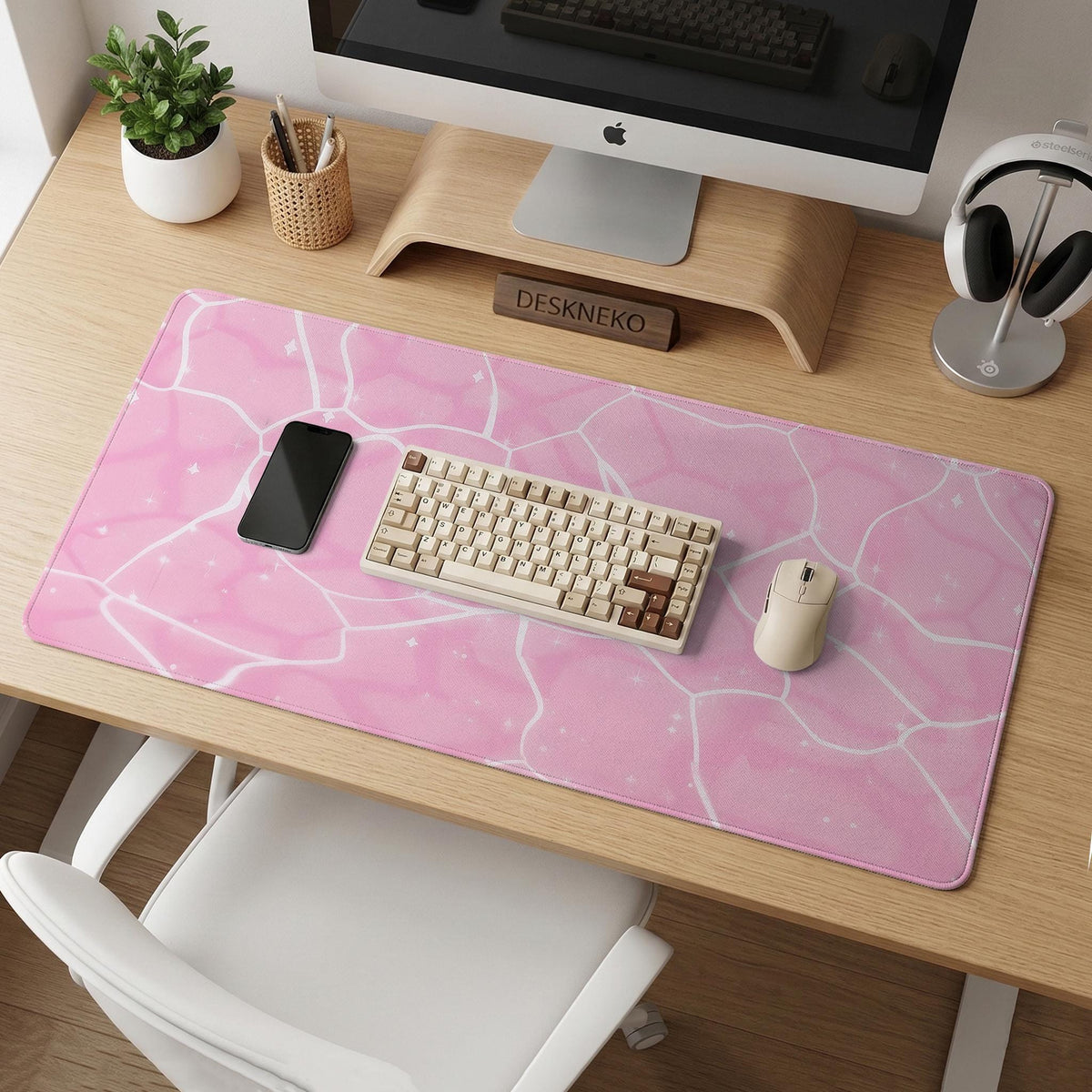 Soft pink desk mat with a kawaii cloud-marble pattern, white crackle lines, and small star accents.