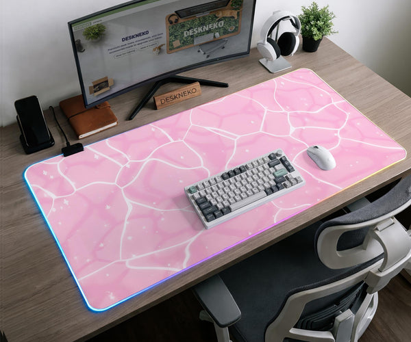 Soft pink desk mat with a kawaii cloud-marble pattern, white crackle lines, and small star accents.