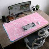 Soft pink desk mat with a kawaii cloud-marble pattern, white crackle lines, and small star accents.