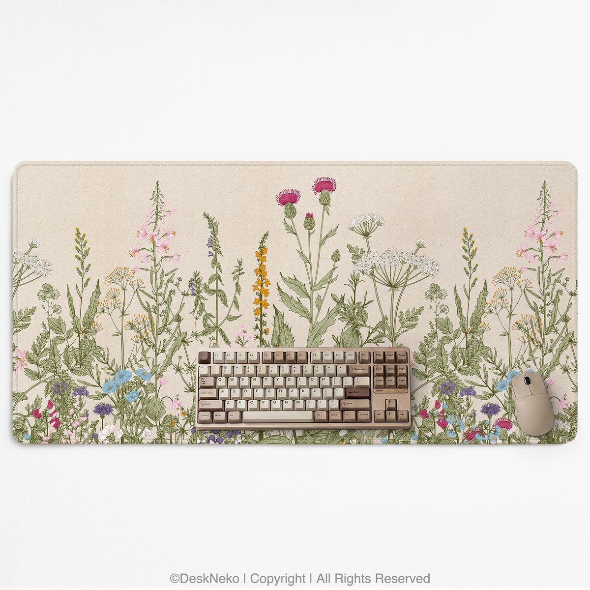 A desk mat with a botanical meadow design featuring wildflowers, leafy stems, and soft neutral colors.