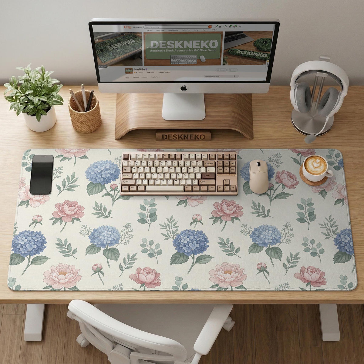 Floral desk mat with sage greenery, pink peonies, blue flowers, and a warm cream background.