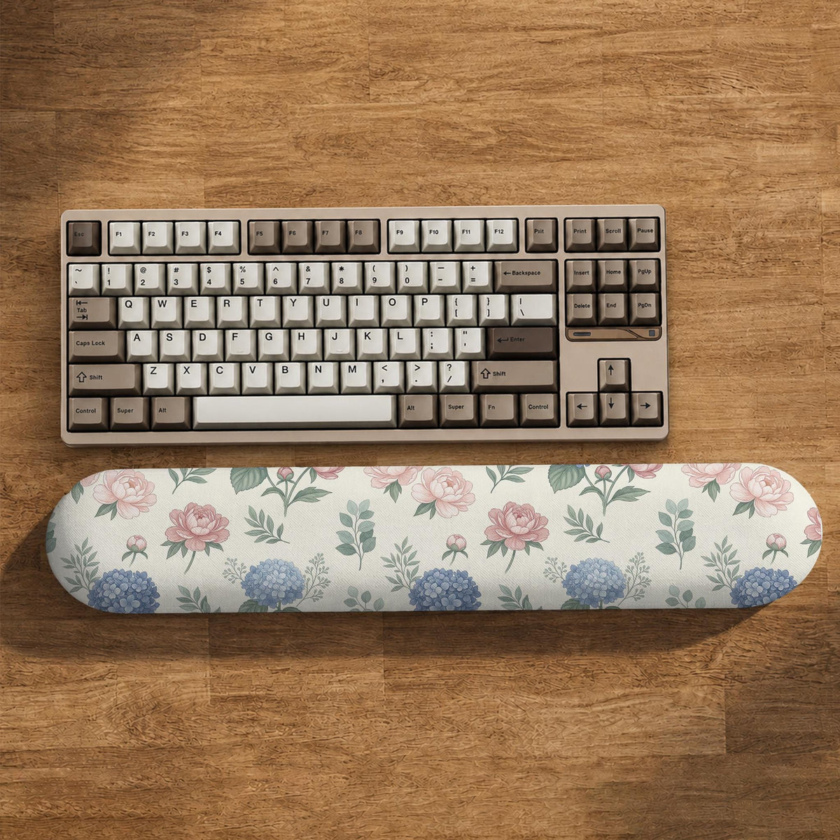 Mousepad and keyboard wrist rest with a floral print of blue hydrangeas, pink peonies, sage leaves, and a cream background.
