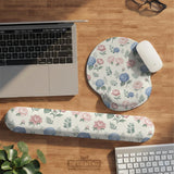 Mousepad and keyboard wrist rest with a floral print of blue hydrangeas, pink peonies, sage leaves, and a cream background.