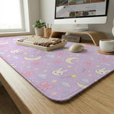 Pastel lavender desk mat with an all-over pattern of bunnies, crescent moons, clouds, bows, stars, and small flowers.