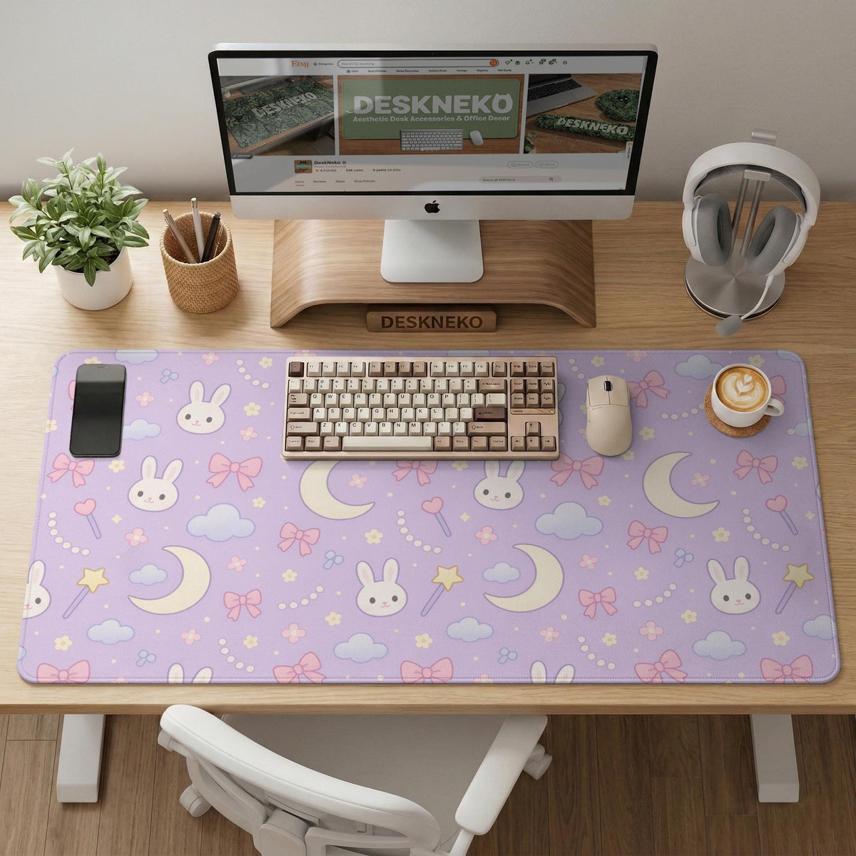Pastel lavender desk mat with an all-over pattern of bunnies, crescent moons, clouds, bows, stars, and small flowers.