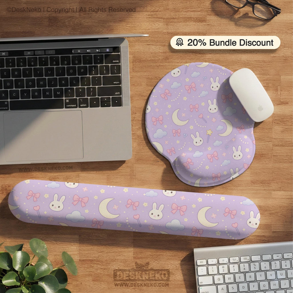Pastel lavender desk mat with an all-over pattern of bunnies, crescent moons, clouds, bows, stars, and small flowers.