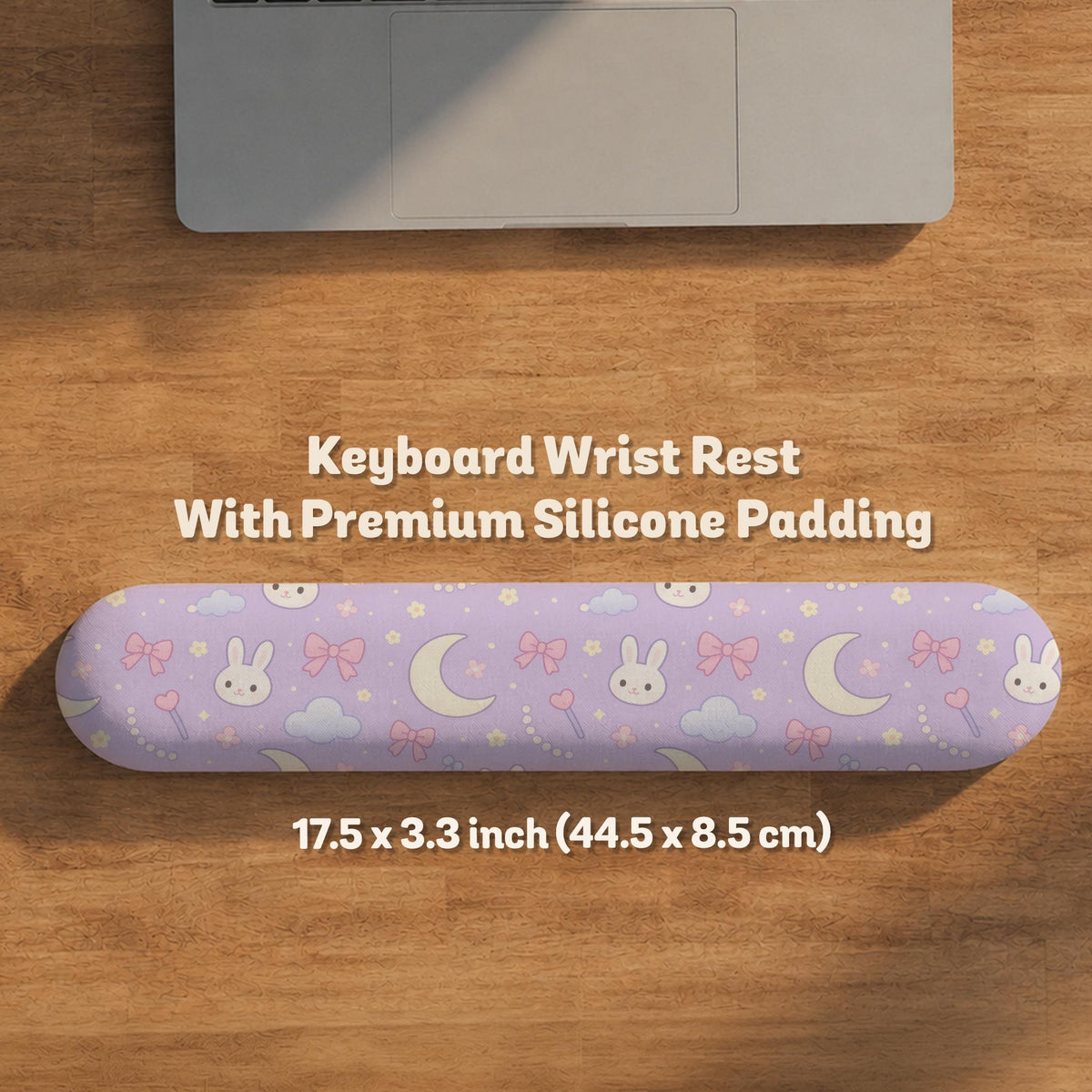 Pastel lavender desk mat with an all-over pattern of bunnies, crescent moons, clouds, bows, stars, and small flowers.