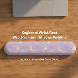Pastel lavender desk mat with an all-over pattern of bunnies, crescent moons, clouds, bows, stars, and small flowers.