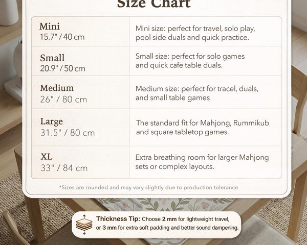 Square mahjong mat with a light floral border in sage green, cream, and blush around a plain center play area.